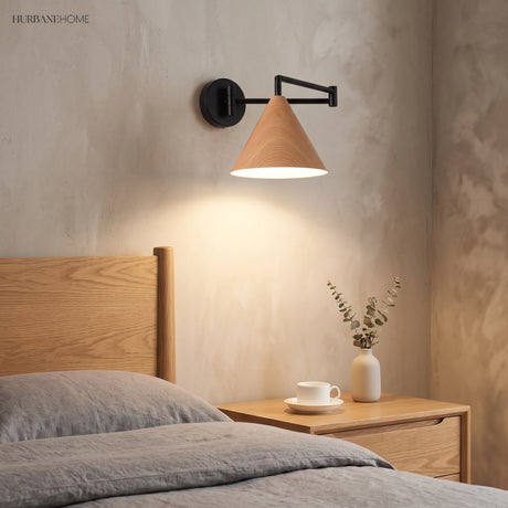 Cone shade swing arm wall sconce in a styled bedroom