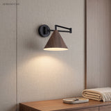 Cone shade swing arm wall sconce in a styled interior