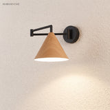 Cone shade swing arm wall sconce on a textured wall