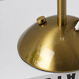 Detail of the push button control set into the rim of the lamp base