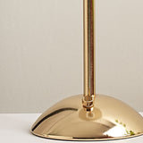 Close-up of the gold domed base and small control knob on the stem