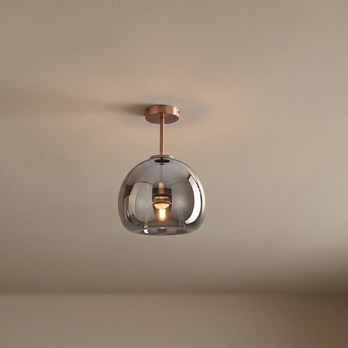 Copper and smoke glass semi flush ceiling light on a plain ceiling