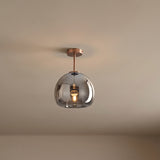 Copper and smoke glass semi flush ceiling light on a plain ceiling