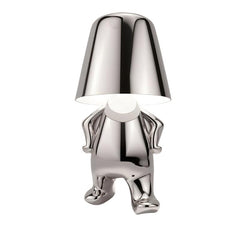Silver figurine lamp standing upright holding the shade overhead