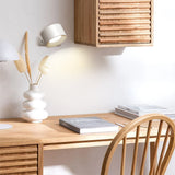 Cordless wall sconce shown from the side