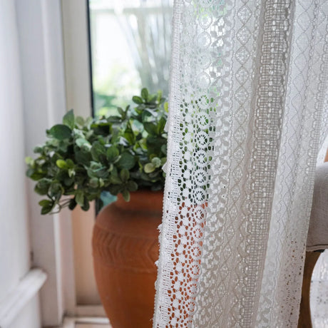 Cotton crochet lace curtains with tassel trim in bright living room