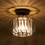 Black wire cage flush mount ceiling light holding vertical crystal glass bars