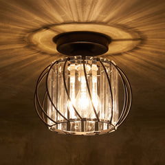 Black wire cage flush mount ceiling light holding vertical crystal glass bars