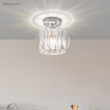 Chrome finish crystal cage ceiling light casting a bright ring of light
