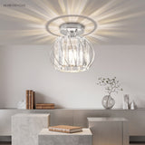 Crystal cage flush mount ceiling light fitted close to a plain ceiling