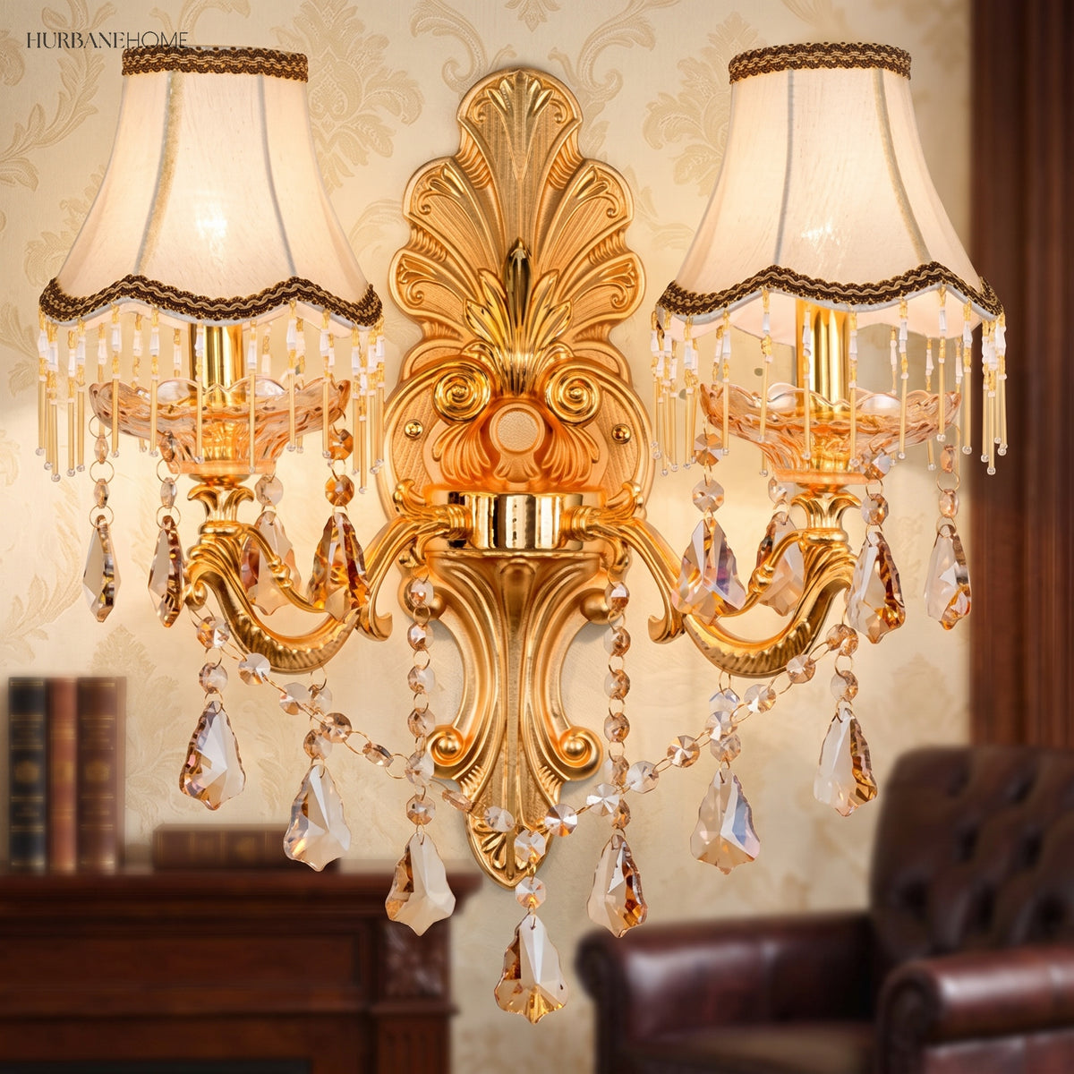 Two light gold sconce with fabric shades above a leather armchair