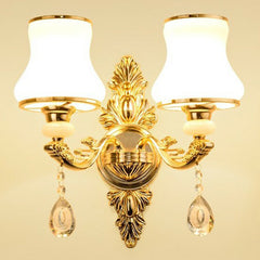 Gold two light sconce with rounded opal glass gourd shades