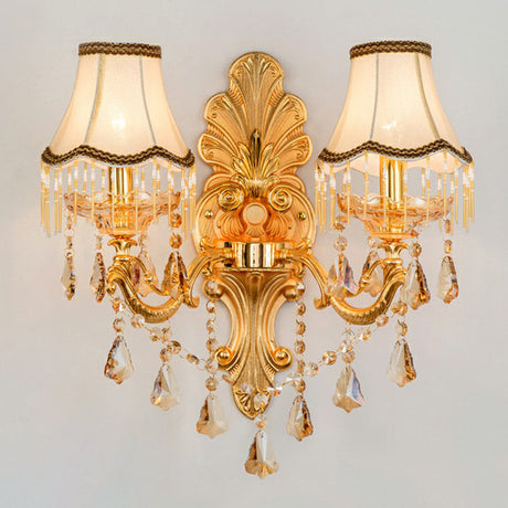 Gold two light sconce with fabric shades and layered crystal strands