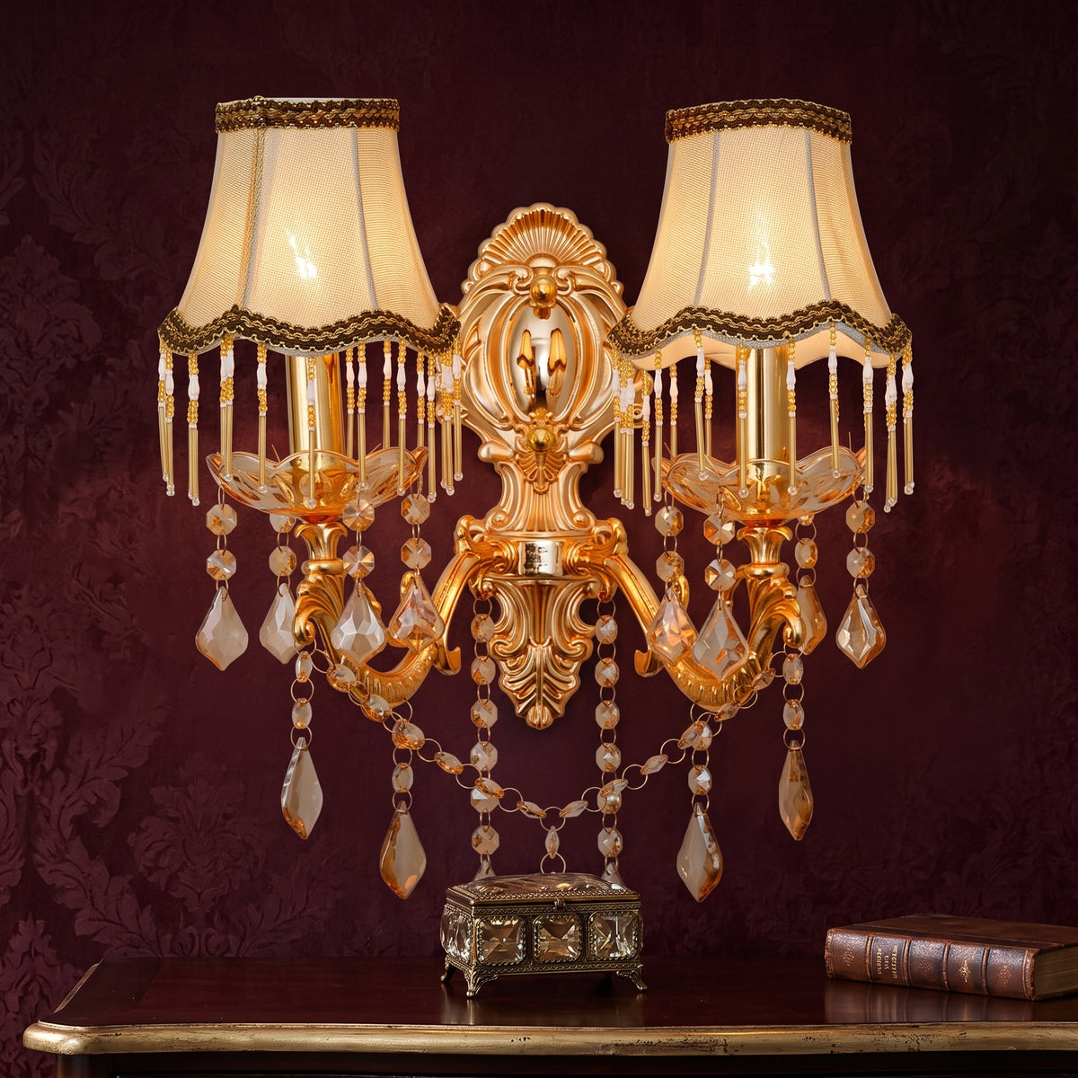 Gold two light candle sconce with fringed shades and crystal drops