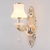 Silver scrolled backplate sconce with a bell shaped opal glass shade