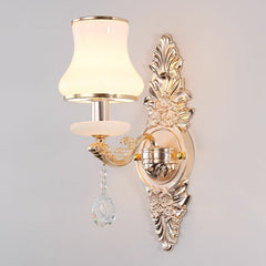 Silver scrolled backplate sconce with a bell shaped opal glass shade