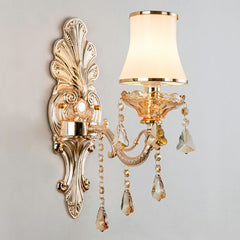 Silver single light sconce with an opal glass shade, studio view