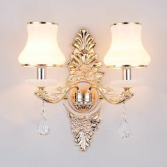 Silver two light sconce with opal glass shades and crystal drops