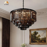 Crystal chandelier lit to show the warm glow through its glass prisms
