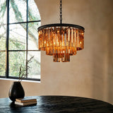 Close view of faceted crystal prisms hanging from the chandelier metal frame