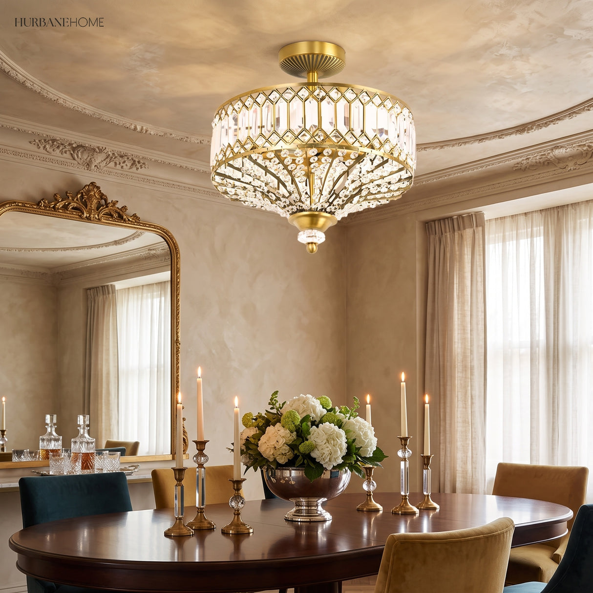Gold crystal drum ceiling light above a candlelit dining table