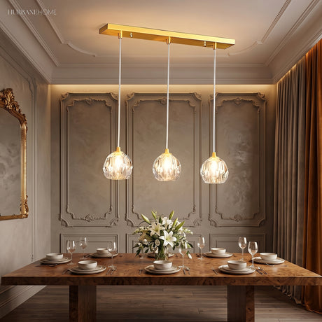 Crystal pendant casting refracted light across a dark panelled wall