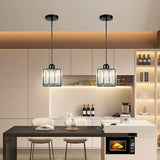 Two mini crystal pendants above a pale kitchen counter and bar stools