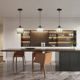 Three mini crystal pendants in a row above a long kitchen island