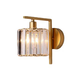 Crystal column sconce lit straight on against a pale wall