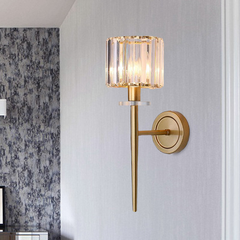 Crystal sconce mounted on floral wallpaper beside white trim