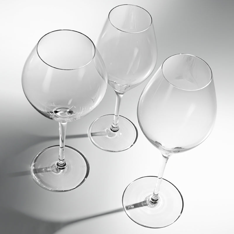 Crystal wine glasses set of 6 arranged on dining table