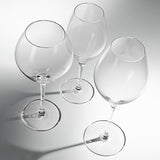 Crystal wine glasses set of 6 arranged on dining table