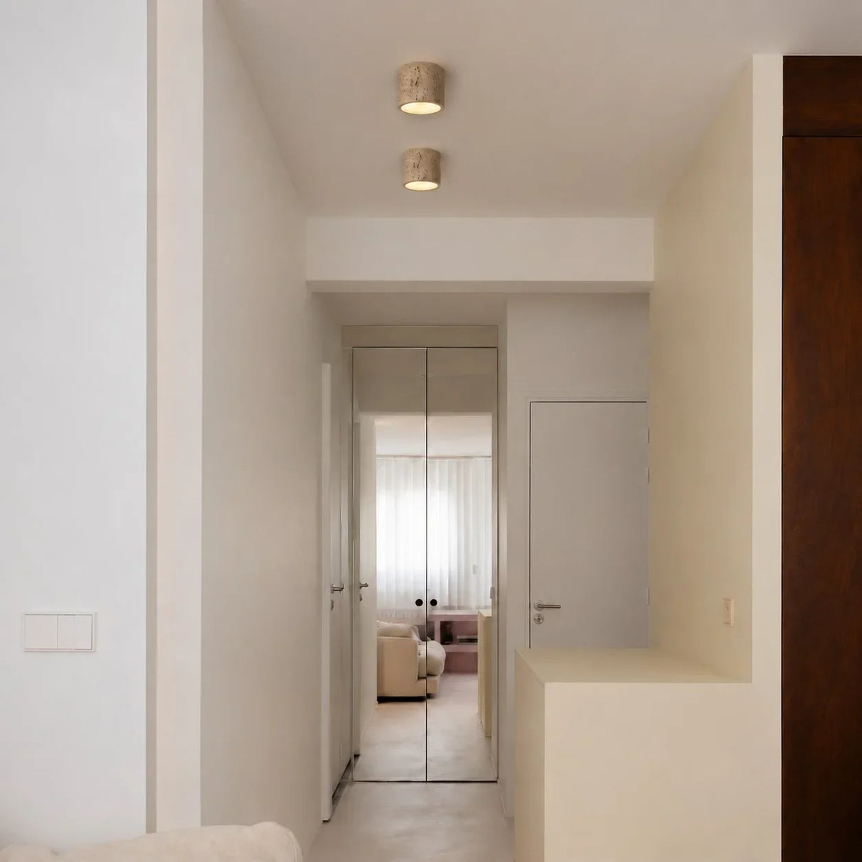 Cylinder ceiling light finish detail showing warm downward glow