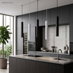 Black and white tube pendants above a kitchen island and sink