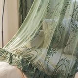 Dark green floral embroidered sheer curtains with ruffle top in a cozy bedroom, adding elegance and privacy.