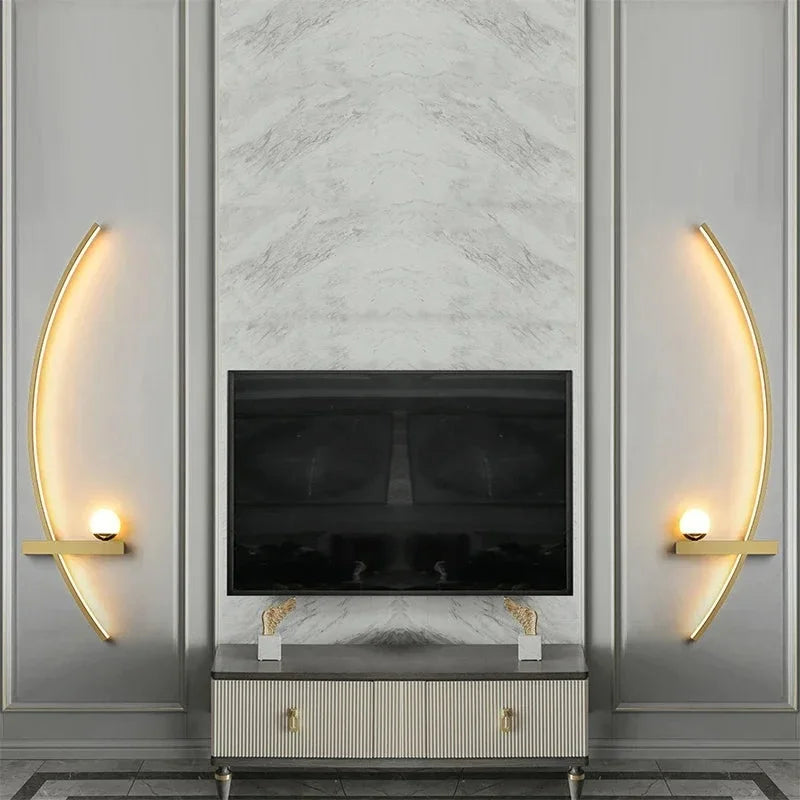 Arc wall light adding a warm accent to a moody dark living room