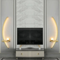 Arc wall light adding a warm accent to a moody dark living room