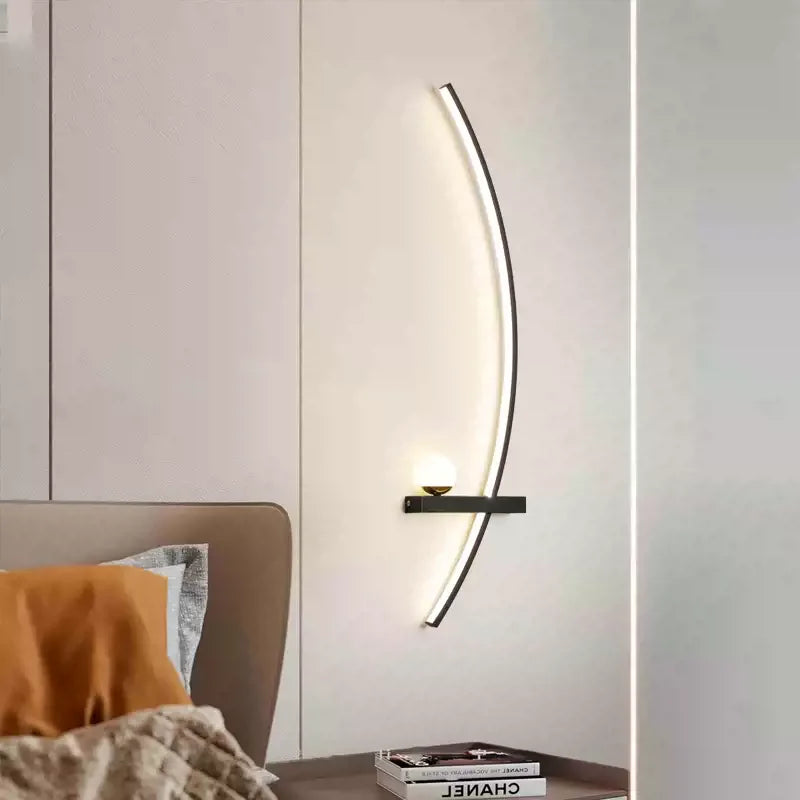 Curved LED sconce mounted in a bright daytime study corner