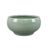 Decorative green planter used as patio accent – outdoor pottery planters