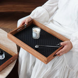 Decorative tray organizer holding small accessories on coffee table
