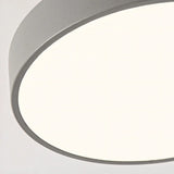 Detail view of the round wood ceiling light frame and painted drum edge