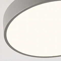 Detail view of the round wood ceiling light frame and painted drum edge