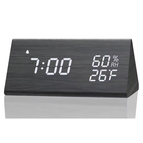 Digital table clock with LED display and sound activation