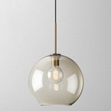 Studio shot of the largest amber glass globe shade lit warm