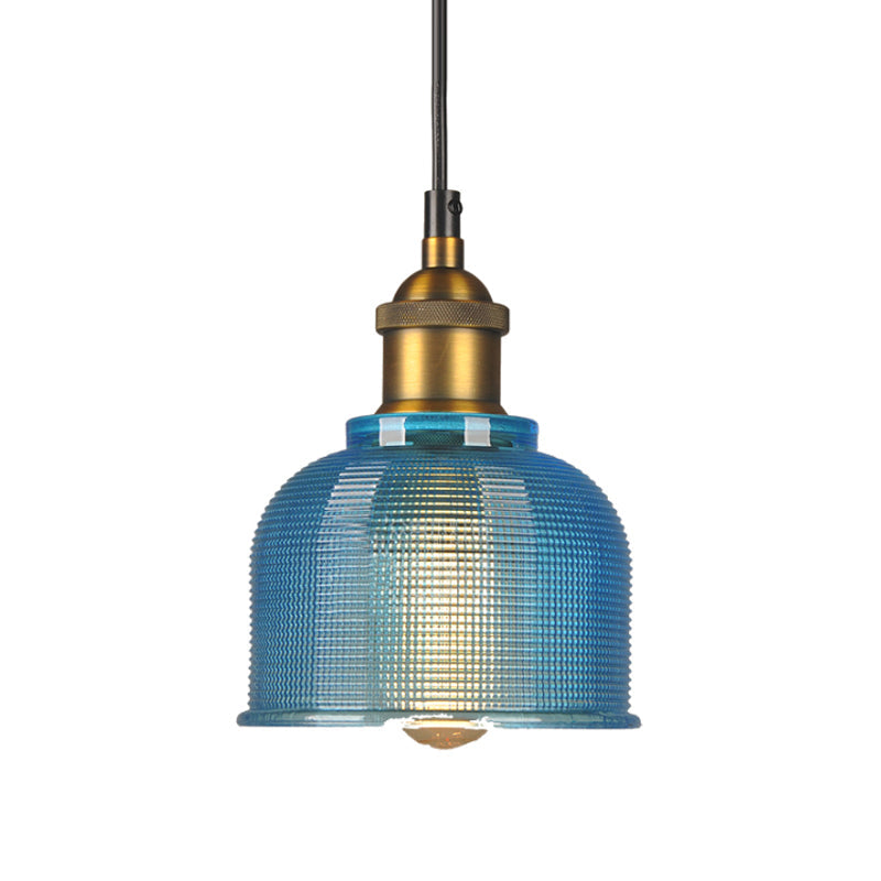 Blue gridded glass bell shade with a brass socket, shown unlit