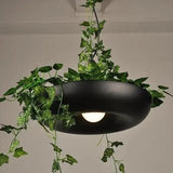 Black ring planter pendant with ivy trailing over the rim