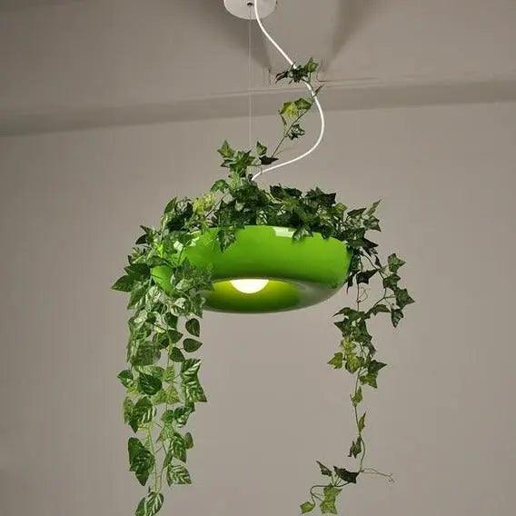 Green ring planter pendant with ivy trailing down from the rim