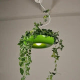Green ring planter pendant with ivy trailing down from the rim