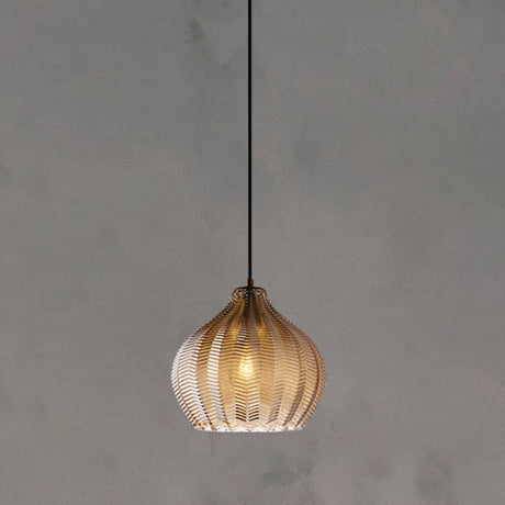 Cognac ribbed pendant with a rounded shade lit on concrete