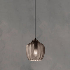 Smoke ribbed pendant with a rounded shade, lit against grey